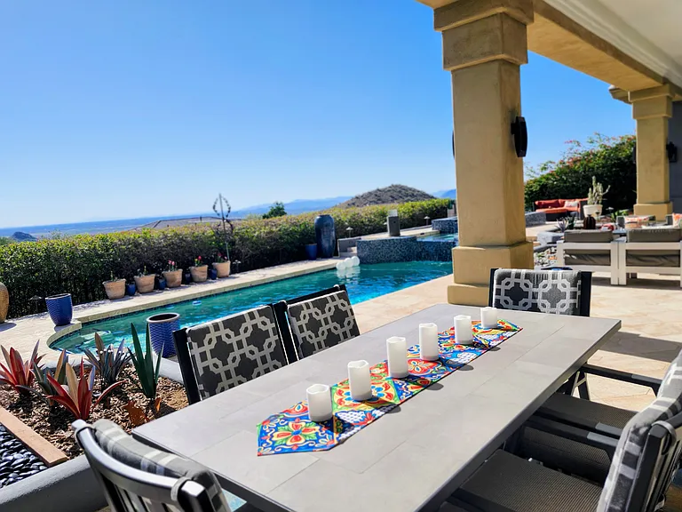 Covered patio dining with amazing sunset over Camelback Mountain views