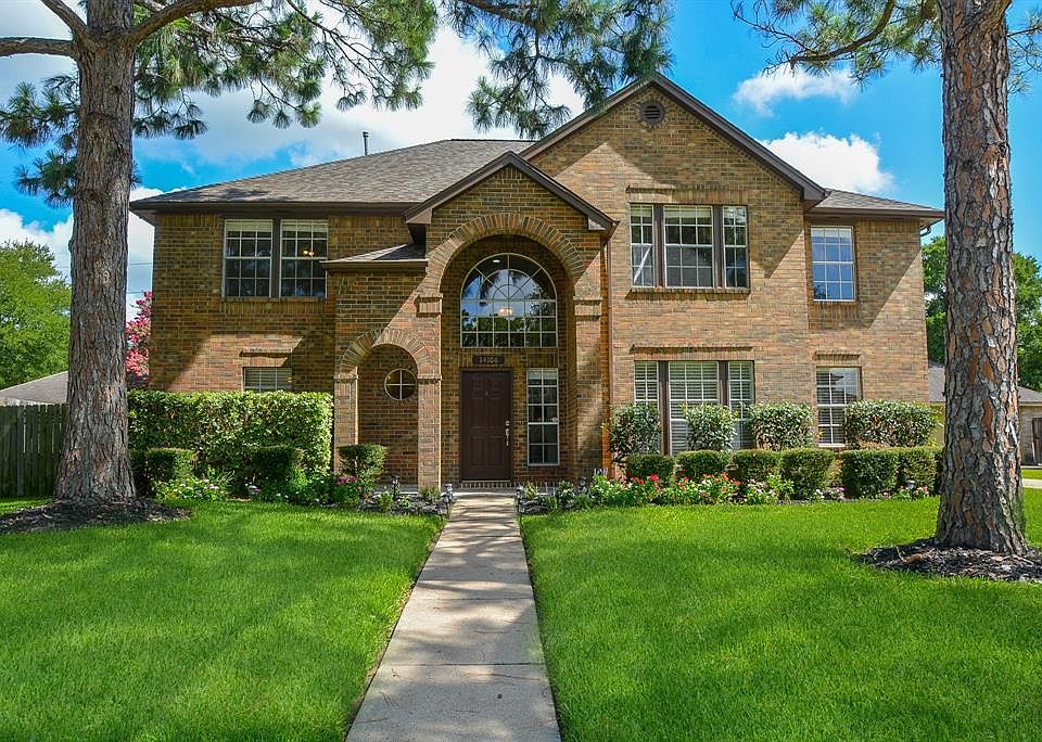 Welcome Home to this charming two story house surrounded by mature trees and lovely landscaping.