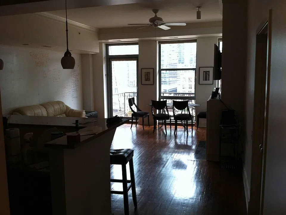View of the Loft Open Area with the Island and stools on the left.