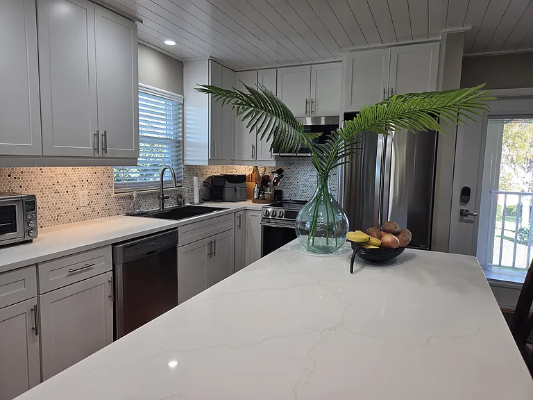 Kitchen renovated 2026 with new solid-wood cabinets (Thomasville), New stainless steel appliances, new quartz countertops. Shiplap ceiling also added 2026