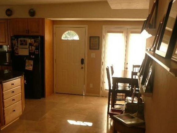 Front door with Kitchen on the left and Dining area on the right