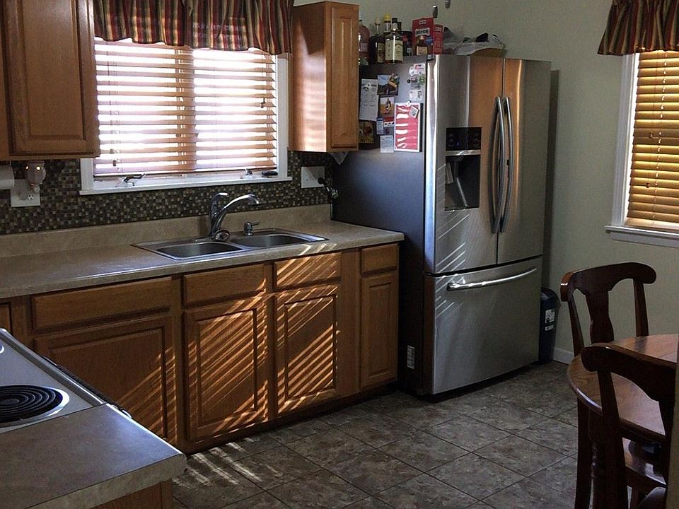 Kitchen with refrigerator