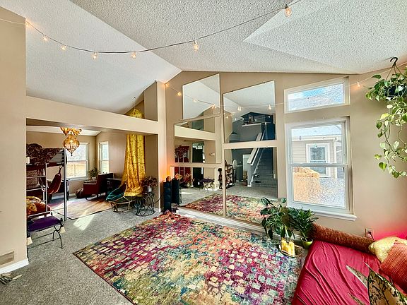 Lots of space for yoga and dance in the colorful living room