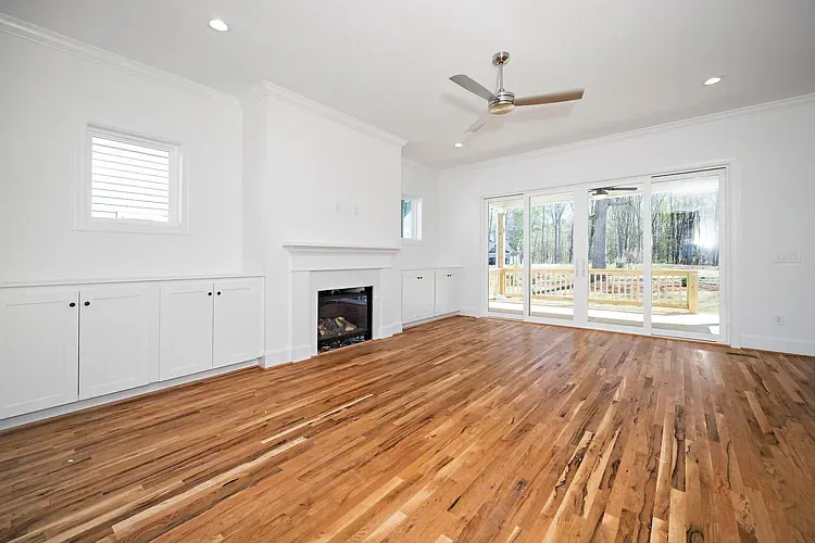 Living Room, site finished hardwood flooring. Privacy fencing in place in backyard. 10 ft celings.