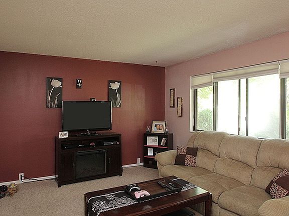 recently repainted to beige living room with accent wall