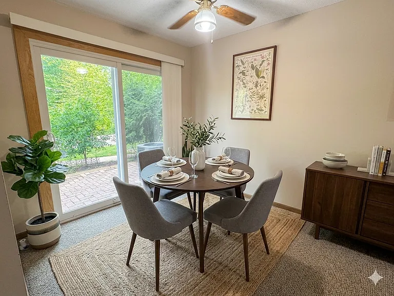 The dedicated dining room offers easy access to your private front patio (virtually staged)