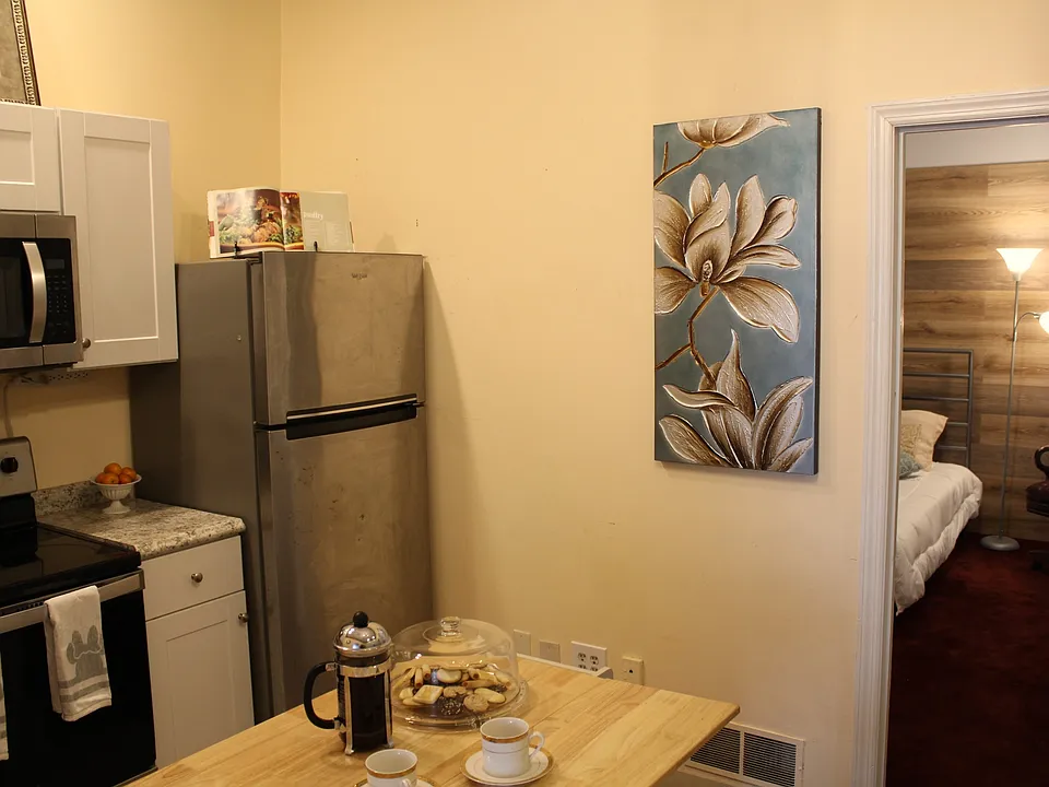 Kitchen with view into bedroom 2