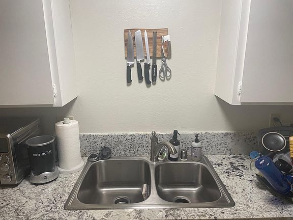 Granite counters, new sink and faucet and garbage disposal.