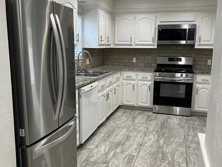 Great kitchen! Natural light, tree view from sink with New appliances and lots of cabinet storage!