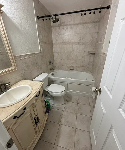 Main bathroom high end finishes with jacuzzi jetted tub and rain shower head