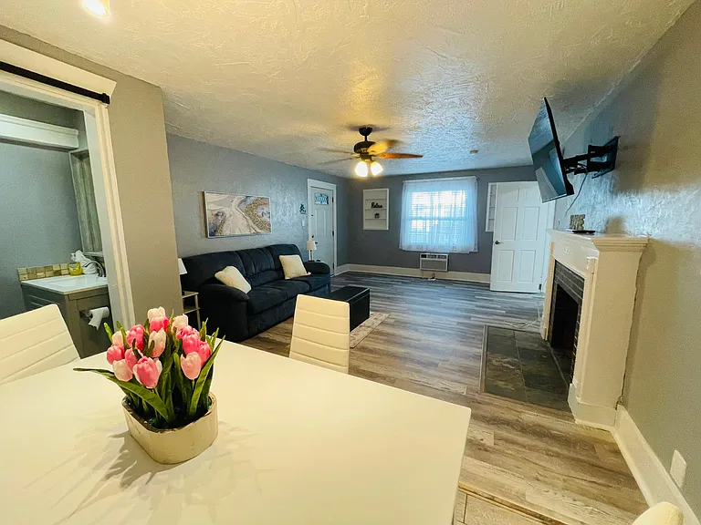 Dinning room and living room with a 65 inch tv and premium channels