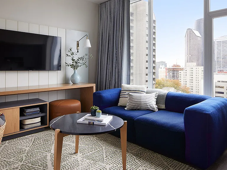 Designer-Furnished Apartment Suites Include a 55" Flatscreen Smart TV with Complimentary WiFi