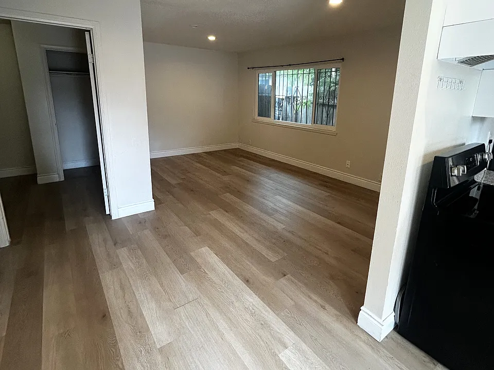 Spacious living room by the kitchen