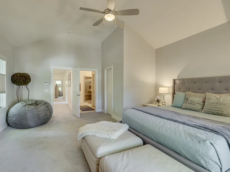 The spacious primary suite also features a Queen Cordaroy convertible lounger, an oversized walk-in closet, and a luxurious ensuite bathroom, creating a private retreat with plenty of space to relax and unwind.