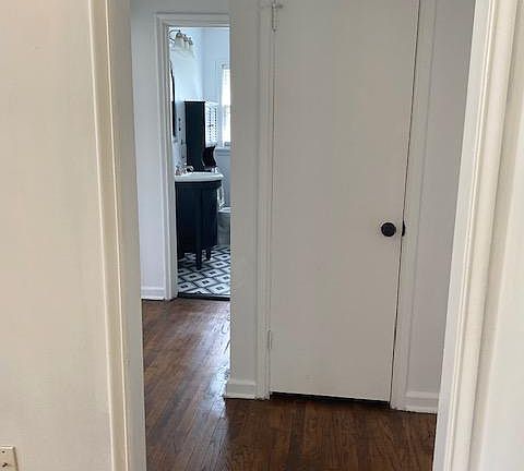 HALLWAY FROM LIVING TO BEDROOMS AND BATH, SHOWING 1ST LINEN CLOSET