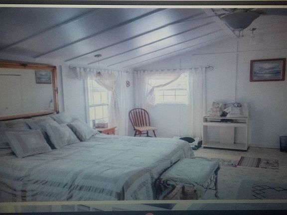 bedroom with vaulted ceiling
