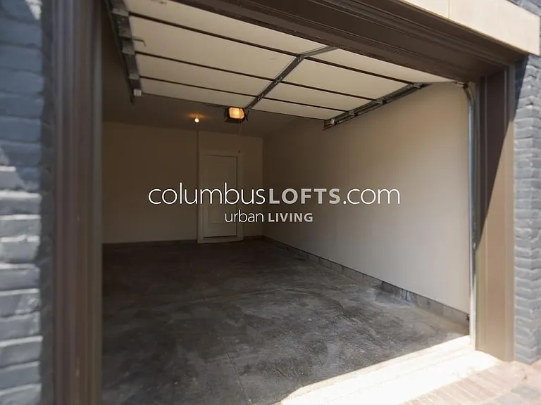 attached 1-car garage. door inside at rear of garage opens to interior stairwell that leads up to living room
