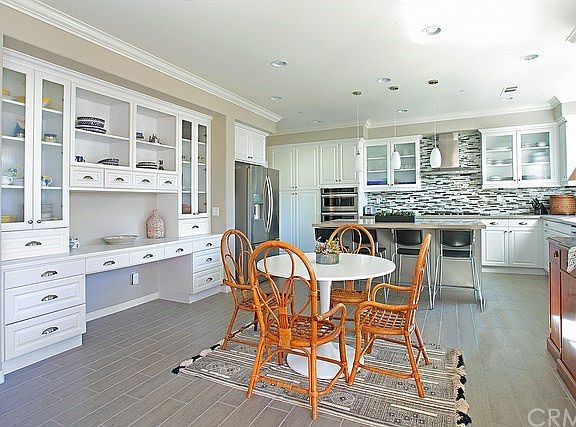 Dining area with built-in cabinets and desk