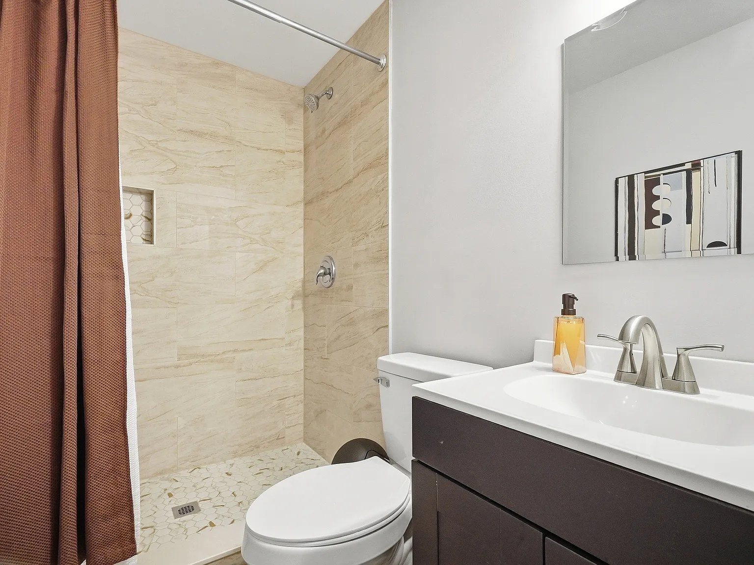 Private en-suite bathroom with walk-in shower and modern finishes.