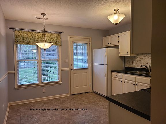 Eat in kitchen w/ high windows