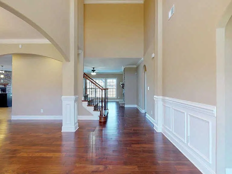 Impressive grand entry with natural light and vaulted ceilings