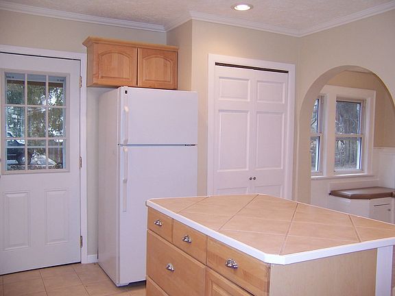 Archway opens to breakfast nook.