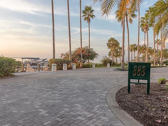 Once through the security gate, drive along the Sarasota Bay to the 888 building entrance.
