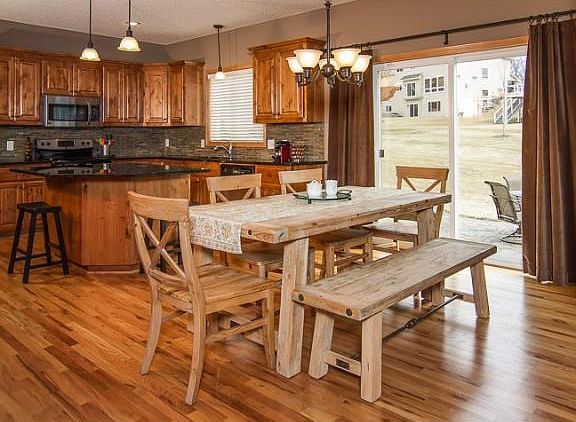 Dining room off of the kitchen with a sliding glass door leading to the custom patio.