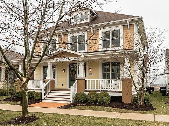 A Rowles Custom Built home features a Full Covered Front Porch with Trex Decking and Vinyl Railings.