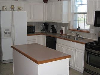 11 X 21 kitchen area with work island, appliances