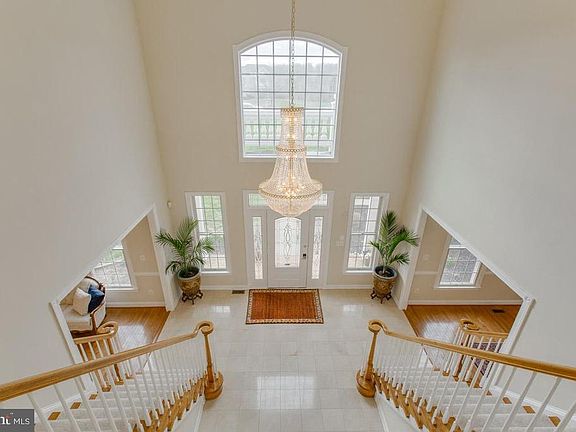 Gorgeous  double staircase with open floor plan