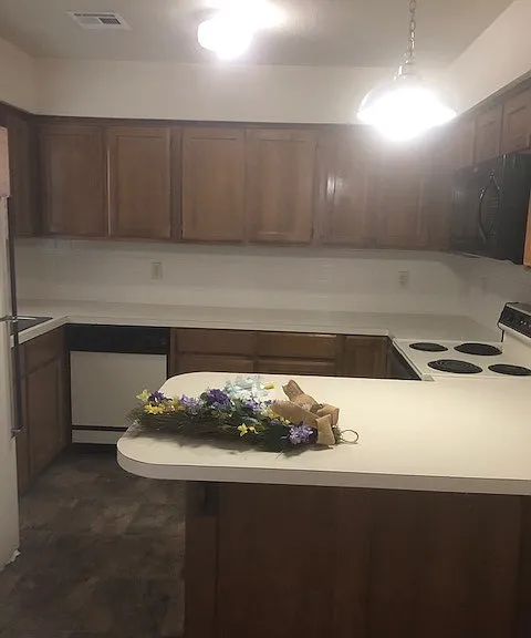 View of kitchen from standing in living room