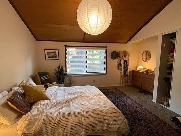 Master bedroom with vaulted ceiling.