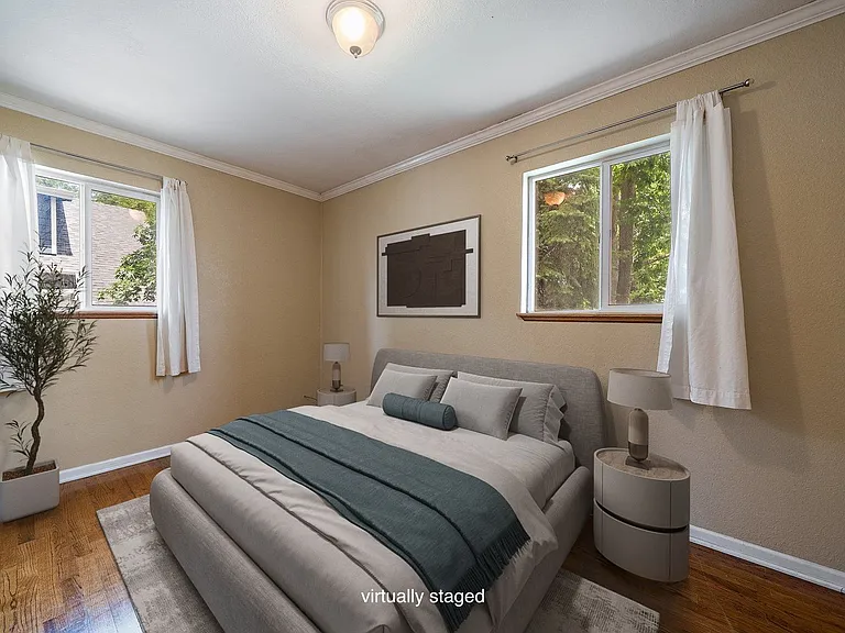 1 of 2 bedrooms (NE corner of upper unit) and virtually staged photo