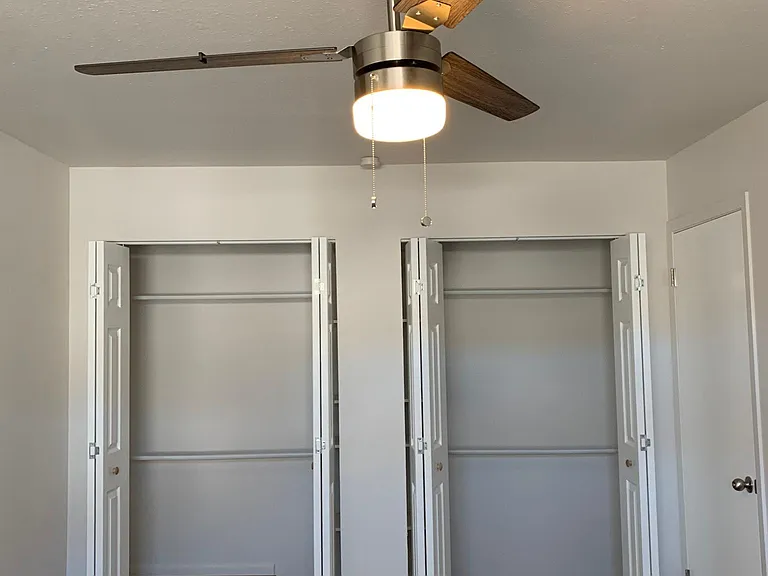 Double closets with shelves in the middle, new closet kits