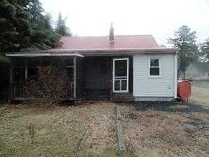 Back of house with screened porch