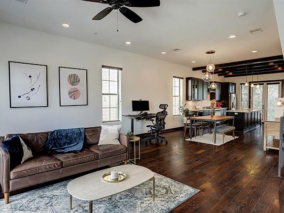 Living room featuring wood floors and lots of natural light