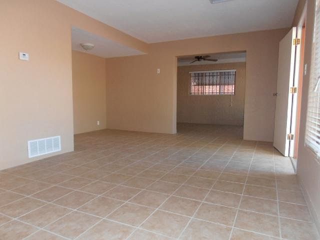 Tile floors throughout. Big living/dining/den areas. Central AC and also evap cooling.