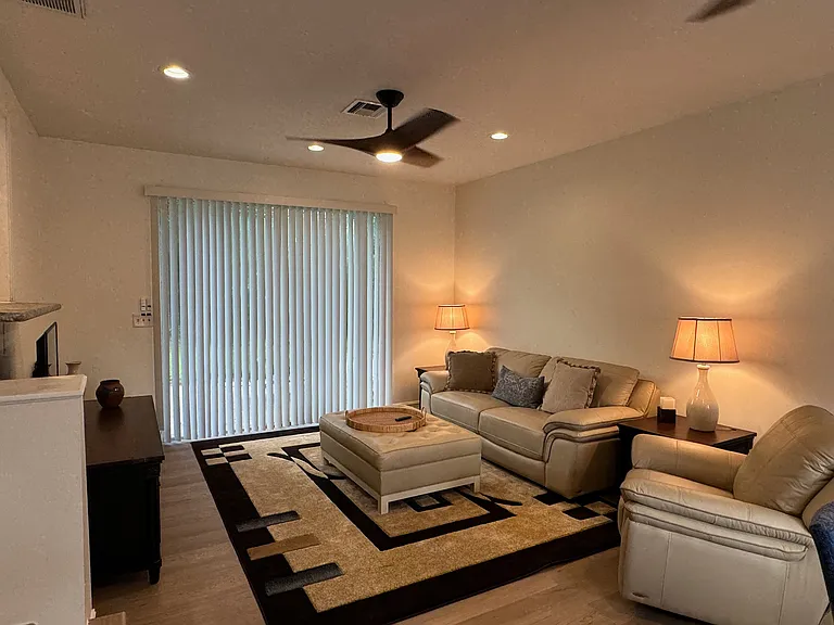 Living Rm w/ Sliding doors to private paved patio.