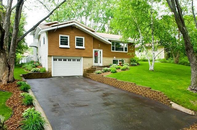 Front view of house, with extra wide driveway for additional parking