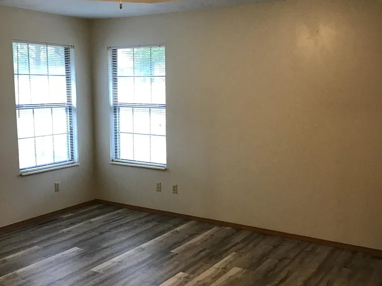 Master bedroom with tray ceiling; has attached bathroom