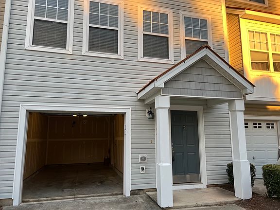 Front Main door with the Garage door open view.