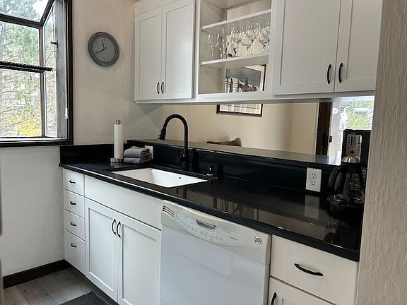 New kitchen fully stocked with dishes and cookware