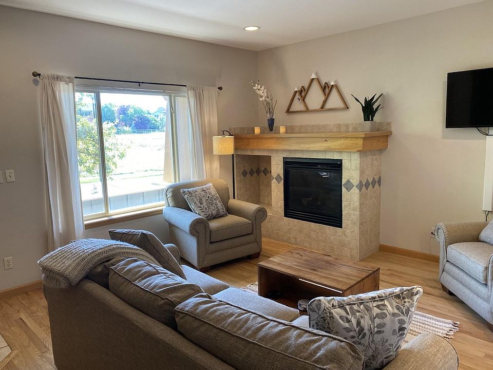 Living room with view of open space across the street