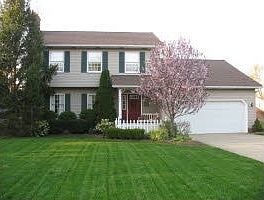 Perfectly maintained colonial on beautifully landscaped lot.