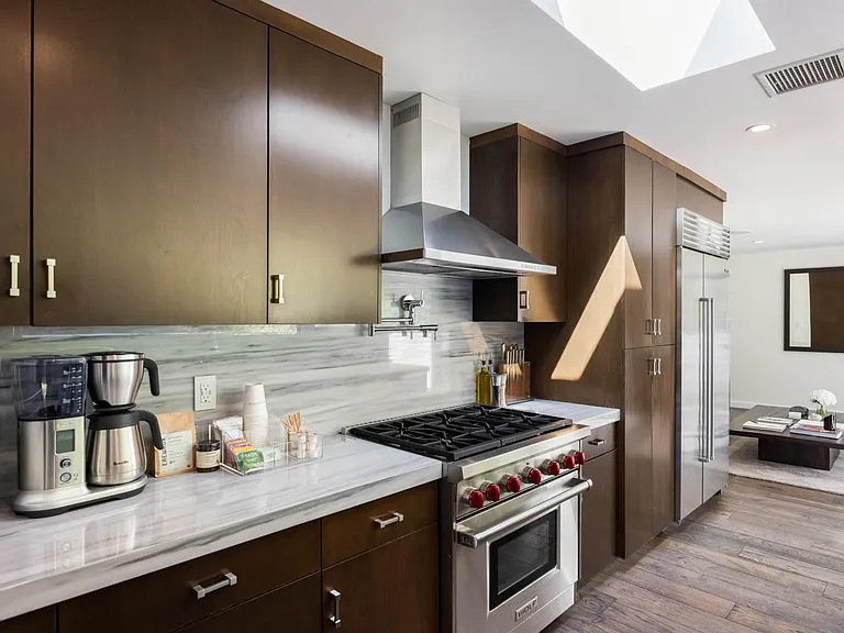 Cook up culinary delights on the modern stove and appliances, ensuring a seamless cooking experience.