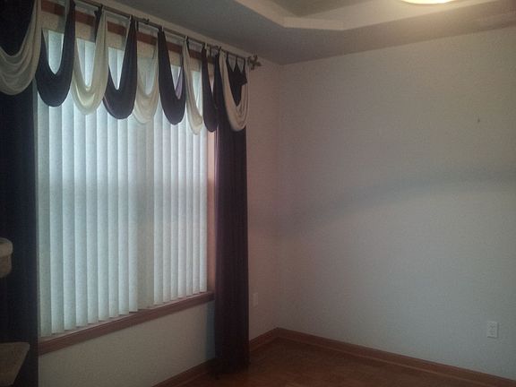 Formal dining room with trayed ceiling