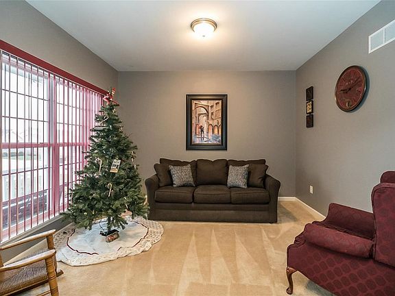 A view of the Flex Room from the Main Entry.  The double window overlooks the covered front porch.  This could easily be a light, bright, and spacious home office.