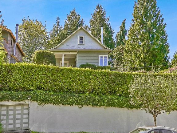 Perched above the street with a secluded yard and great view.