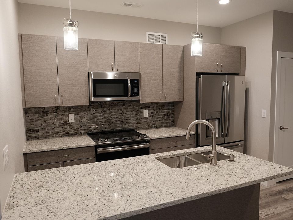 Beautiful modern kitchen with upgraded stainless steel appliances, granite and soft close cabinets/drawers.